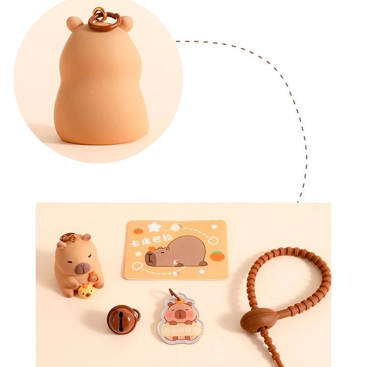 Móc khóa Silicon hình Capybara gõ mõ